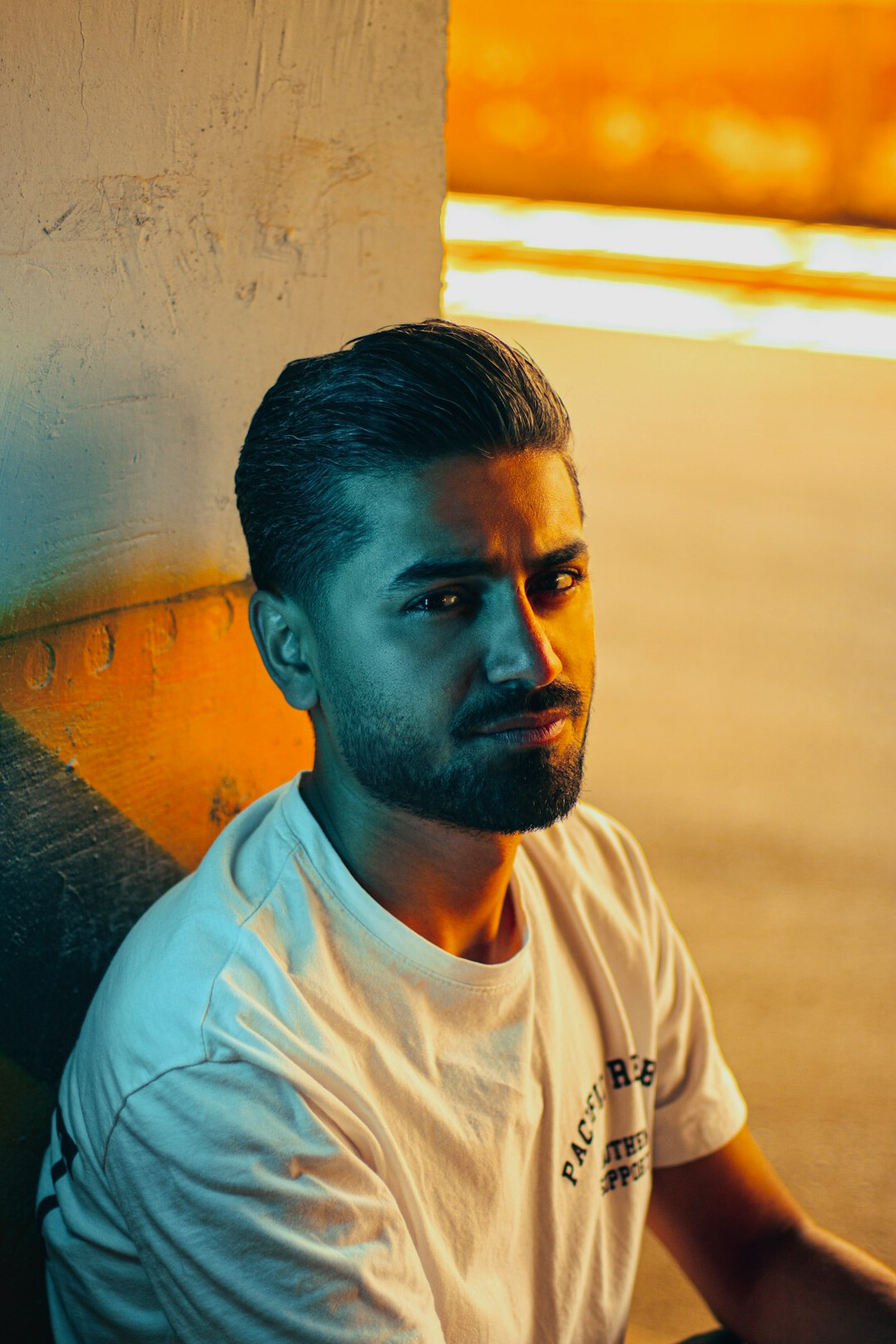 Portrait of a man with a short beard looking at the camera