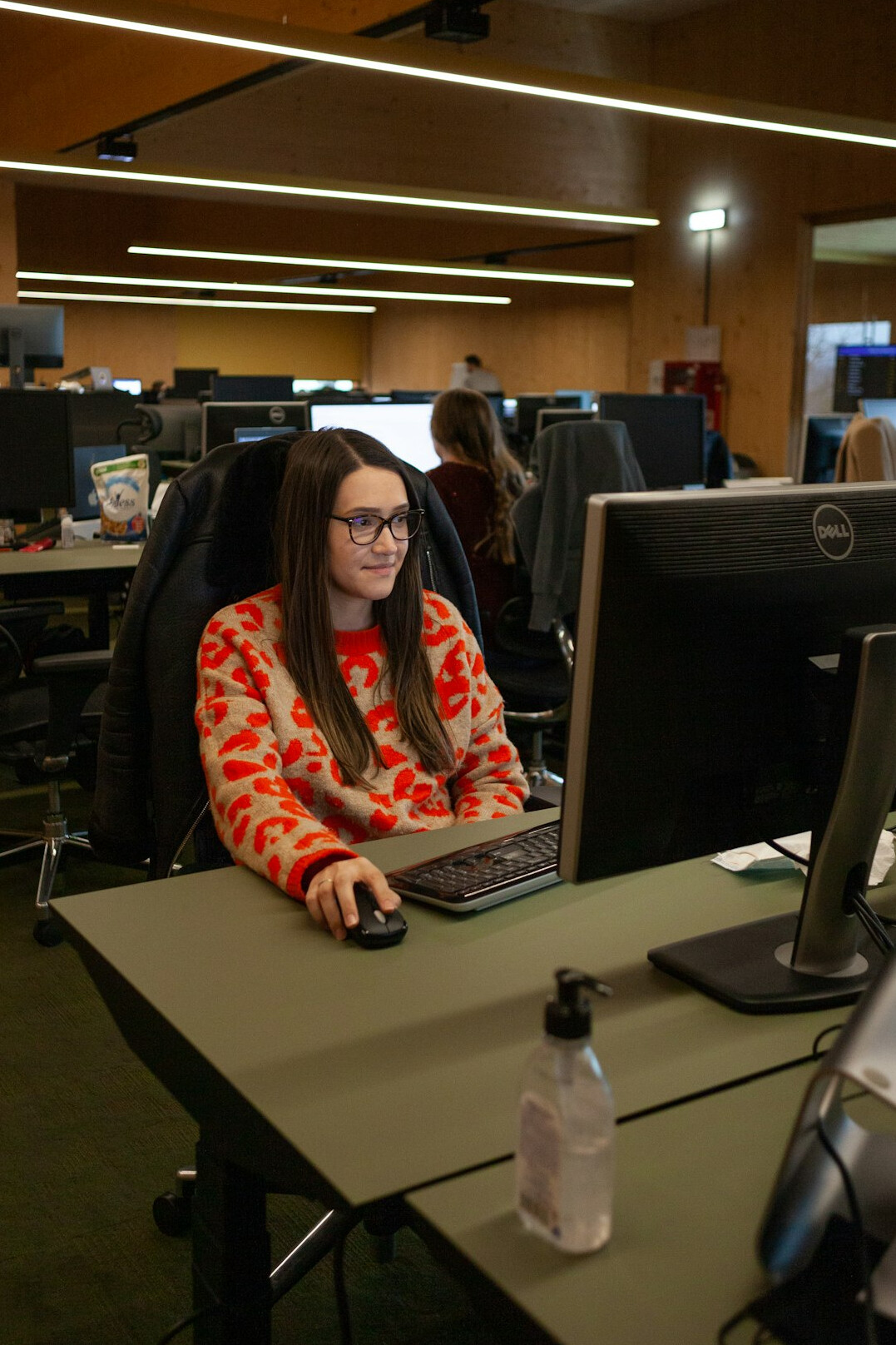 woman coding at desk