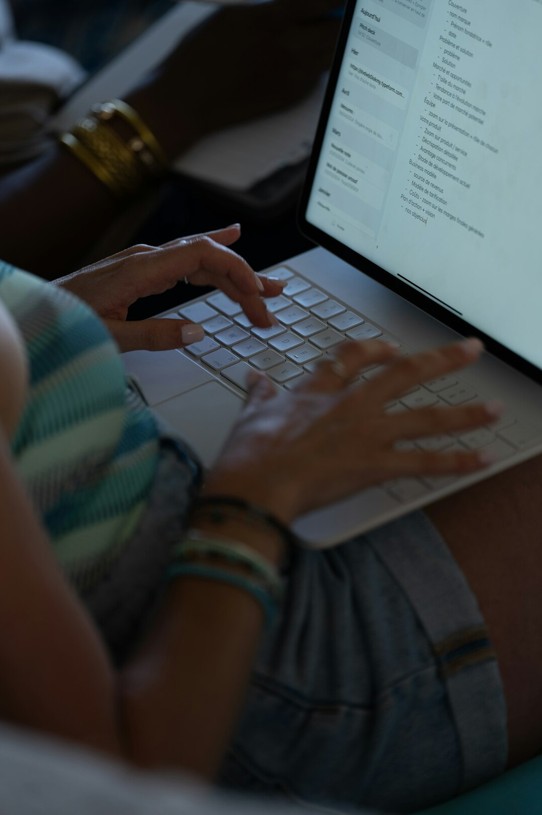 person writing code on laptop